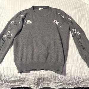 Crew neck wool grey sweater. Light grey and white knitted flowers. Size medium.